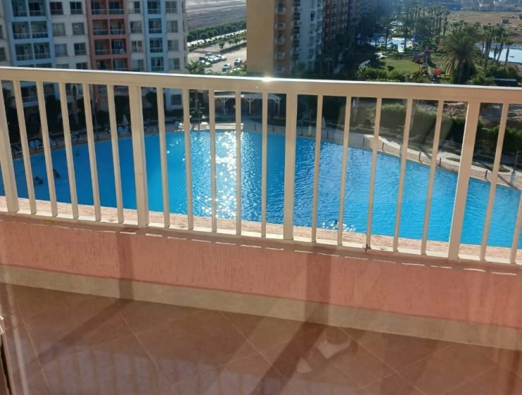 شالية غرفتين ع لاجون مباشر قرية بورتو جولف مارينا الساحل الشمالي