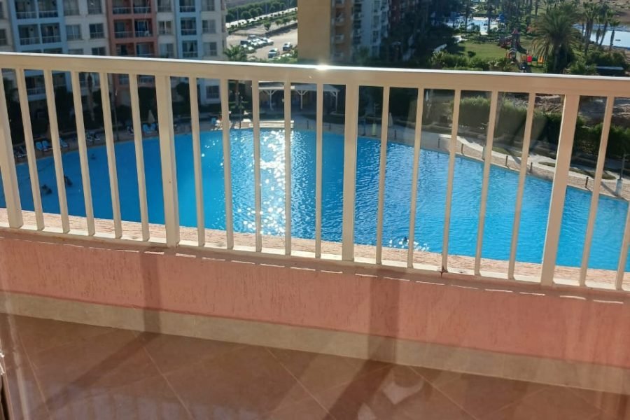 شالية غرفتين ع لاجون مباشر قرية بورتو جولف مارينا الساحل الشمالي